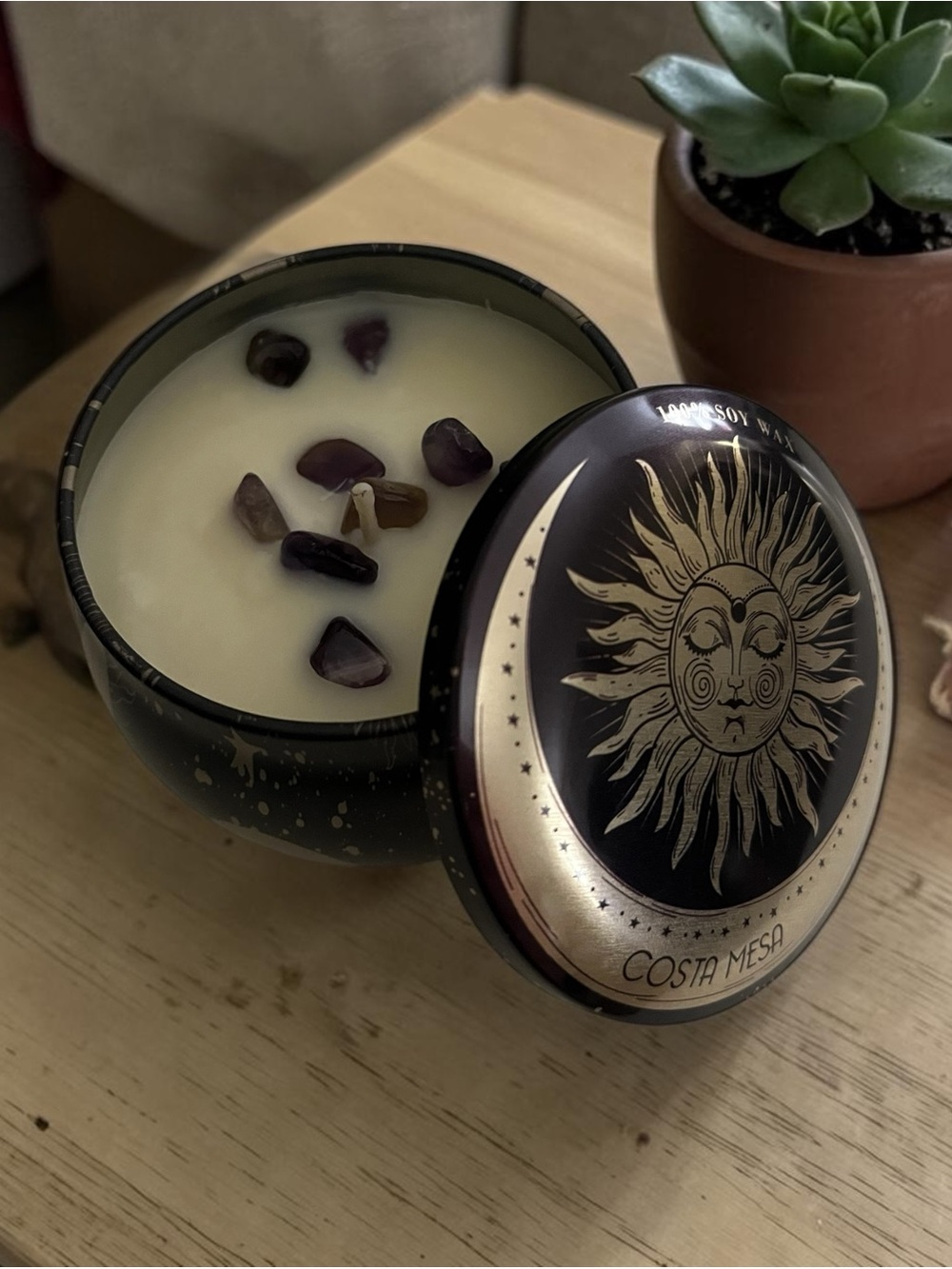 Midnight Ember Soy Candle with Amethyst Stones in it.